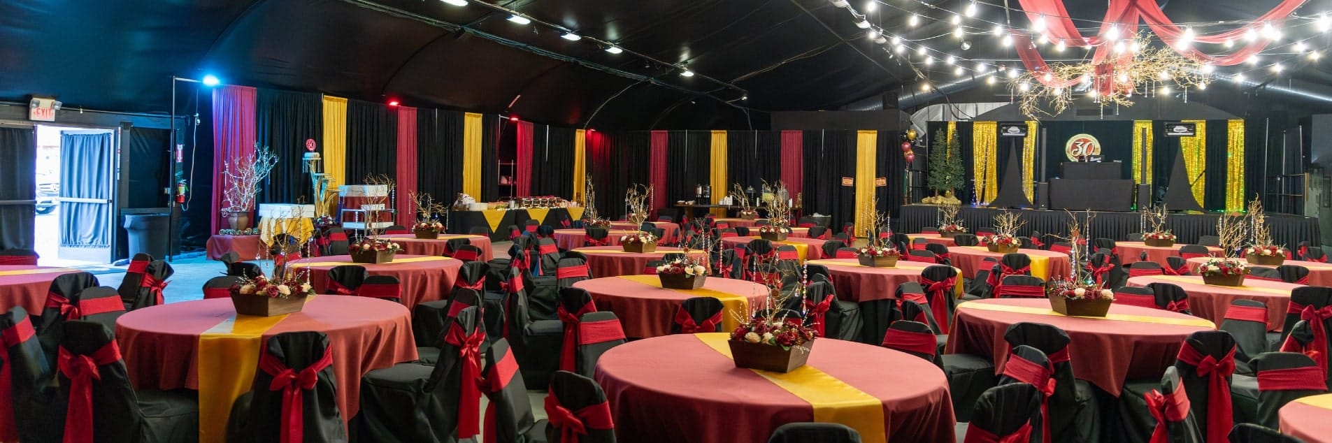 event space with tables and streamers