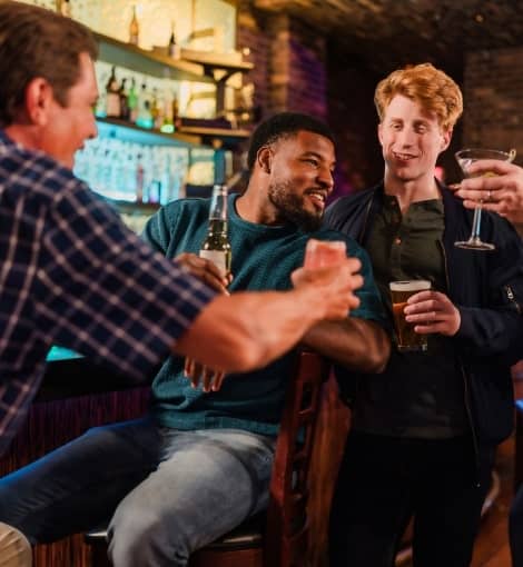 men enjoying drinks at bar