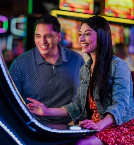 couple playing slot machine