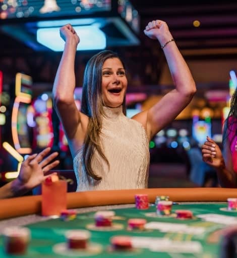 woman cheering at table game